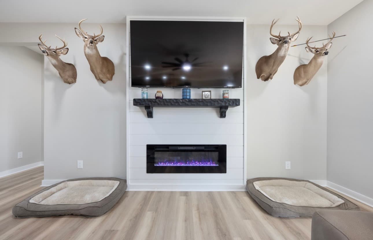 Custom home interior featuring fireplace and TV wall