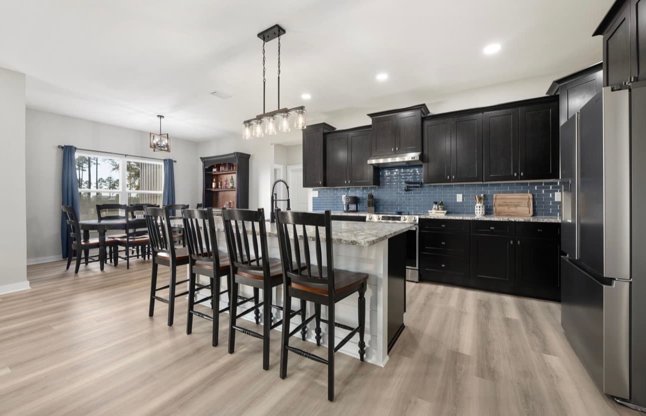 Custom home interior featuring kitchen and dining area